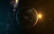 宇宙中的地球与升起的太阳图片素材
